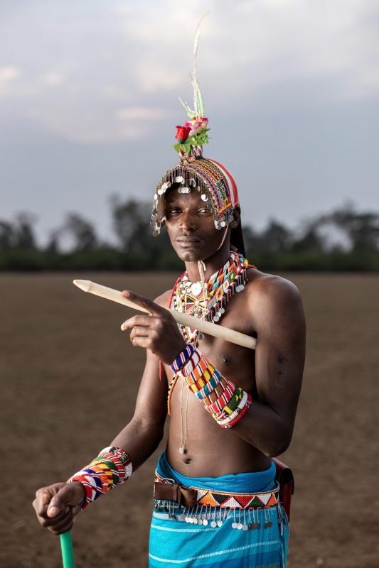 Young man in colourful traditional attire.