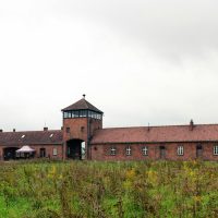 Photo of a red brick building in a Nazi concentration camp.