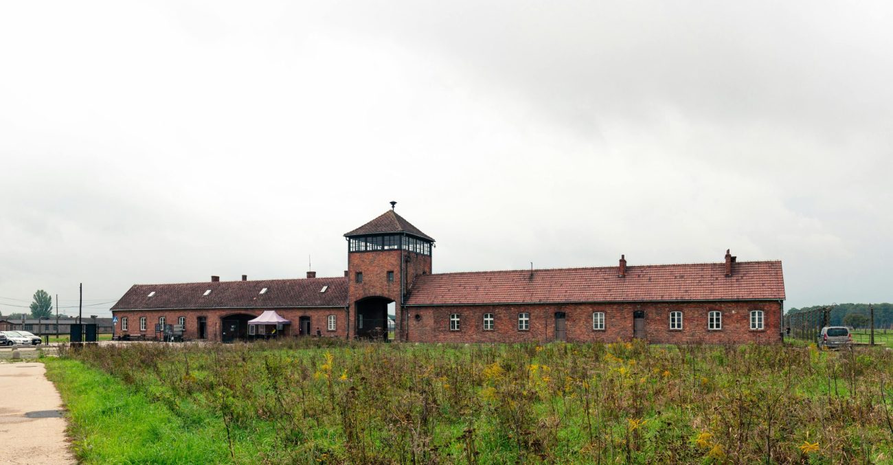 Photo of a red brick building in a Nazi concentration camp.